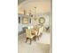 Formal dining room with a large table, elegant chandelier, and decorative wall accents at 1784 Providence Blvd, Deltona, FL 32725