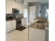 Well-equipped kitchen with stainless steel appliances, custom cabinets, and a spacious island at 1784 Providence Blvd, Deltona, FL 32725