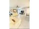 Bright living room with tile floors, a ceiling fan, and a white leather sectional sofa at 1784 Providence Blvd, Deltona, FL 32725