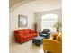 Inviting living room with comfortable seating, arched window, and decorative accents at 1784 Providence Blvd, Deltona, FL 32725