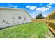 Side yard with a privacy fence and plenty of green space for recreation and relaxation at 1920 Dardanelle Dr, Orlando, FL 32808
