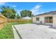 Fenced backyard featuring a concrete patio space, perfect for entertaining and relaxation at 1920 Dardanelle Dr, Orlando, FL 32808