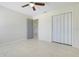 Neutral bedroom featuring a ceiling fan, closet and a ceramic tile floor for easy maintenance at 1920 Dardanelle Dr, Orlando, FL 32808