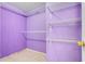 Walk-in closet with wire shelving and purple paint for an organized storage at 1920 Dardanelle Dr, Orlando, FL 32808