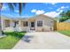 Charming single-story home with a well-manicured lawn and welcoming front entrance with beige concrete driveway at 1920 Dardanelle Dr, Orlando, FL 32808