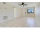 Open living space with tile flooring, a ceiling fan, and natural light, and white walls at 1920 Dardanelle Dr, Orlando, FL 32808