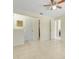 Spacious living room featuring ceramic tile floors, neutral color palette, and a ceiling fan at 1920 Dardanelle Dr, Orlando, FL 32808