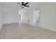 Bright and airy living room showcasing tile flooring, ceiling fan, and an open layout leading to other rooms at 1920 Dardanelle Dr, Orlando, FL 32808