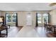 Bright foyer featuring tile flooring, hardwood floors, and large arched windows at 2085 Stone Cross Cir, Orlando, FL 32828