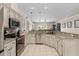 Open kitchen with granite countertops and stainless steel appliances at 2085 Stone Cross Cir, Orlando, FL 32828