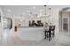 Bright kitchen with stainless appliances, white cabinets, bar seating, and tile flooring at 2085 Stone Cross Cir, Orlando, FL 32828