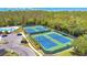 Aerial view of the tennis courts, showcasing a lush green landscape and well-maintained courts at 2085 Stone Cross Cir, Orlando, FL 32828
