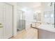 Clean bathroom featuring a shower, a bathtub, double sinks, and tile flooring at 2110 Mallard Creek Cir, Kissimmee, FL 34743