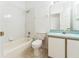 Cozy bathroom with a shower, a tub, a toilet, and a sink at 2110 Mallard Creek Cir, Kissimmee, FL 34743