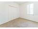Bedroom with carpet, a closet, and a window at 2110 Mallard Creek Cir, Kissimmee, FL 34743