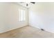 Well-lit bedroom with a ceiling fan, neutral carpet, a window and light-colored walls at 2110 Mallard Creek Cir, Kissimmee, FL 34743