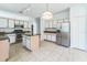 Well-equipped kitchen with island, granite countertops, stainless steel appliances, and ample cabinet space at 2110 Mallard Creek Cir, Kissimmee, FL 34743