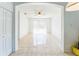 Bright living room with tile floors, neutral walls, ceiling fan, and outdoor access at 2110 Mallard Creek Cir, Kissimmee, FL 34743