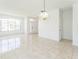 Bright living room with tiled floors, lots of natural light from large windows, and neutral wall color at 2110 Mallard Creek Cir, Kissimmee, FL 34743