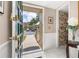 Inviting entryway with tiled flooring, a decorative front door, and a view to the outside at 2208 Mcmahon Ct # 1033, Orlando, FL 32812