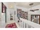 Upstairs hallway with multiple Gathering photos and ceiling fan at 2208 Mcmahon Ct # 1033, Orlando, FL 32812