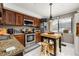 Well-lit kitchen features granite countertops, stainless steel appliances, and functional island at 2208 Mcmahon Ct # 1033, Orlando, FL 32812