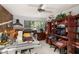 An office space featuring multiple work areas, computers, and an abundance of natural light from a large window at 2208 Mcmahon Ct # 1033, Orlando, FL 32812