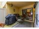 Covered patio space with grill, dining set, and view into the bright dining room at 2208 Mcmahon Ct # 1033, Orlando, FL 32812