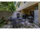 Relaxing patio with table seating, grill, and access to the home's interior at 2208 Mcmahon Ct # 1033, Orlando, FL 32812