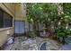 A shaded patio featuring a water fountain, lush greenery, and a cozy seating area at 2208 Mcmahon Ct # 1033, Orlando, FL 32812