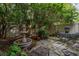 Private patio space with tranquil fountain, lush plantings, and shaded seating area at 2208 Mcmahon Ct # 1033, Orlando, FL 32812