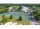Aerial view of community tennis courts surrounded by lush trees at 2208 Mcmahon Ct # 1033, Orlando, FL 32812