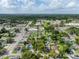 Aerial view showing a property outlined in yellow, surrounded by lush greenery and neighborhood streets at 2320 E Crystal Lake Ave, Orlando, FL 32806