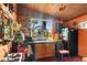 Rustic kitchen with wood cabinets, a vintage stove, and an eclectic decor at 2320 E Crystal Lake Ave, Orlando, FL 32806