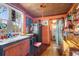 Rustic kitchen with wood cabinets, a vintage stove, and an eclectic decor at 2320 E Crystal Lake Ave, Orlando, FL 32806