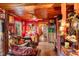 Cozy living room featuring eclectic furniture, hardwood floors, and unique decorative items at 2320 E Crystal Lake Ave, Orlando, FL 32806