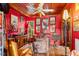 Eclectic living room featuring wood floors, a ceiling fan, and vintage decor accents at 2320 E Crystal Lake Ave, Orlando, FL 32806