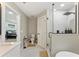 Bathroom with glass shower, toilet, and sink, complemented by patterned tile flooring at 2350 Derbyshire Rd, Maitland, FL 32751