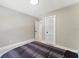 Cozy bedroom with a neatly made bed and a closet door at 2350 Derbyshire Rd, Maitland, FL 32751