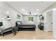 Well-lit bedroom features neutral paint, hardwood floors, and a functional layout with closet space at 2350 Derbyshire Rd, Maitland, FL 32751