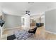 Open concept living area featuring hardwood floors, modern fixtures, and neutral color palette at 2350 Derbyshire Rd, Maitland, FL 32751