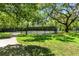 Community tennis courts surrounded by lush greenery, perfect for an active lifestyle at 2350 Derbyshire Rd, Maitland, FL 32751