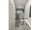 Modern bathroom featuring sleek fixtures, neutral tile, and an updated shower with a rainfall head at 2505 Osprey Creek Ct, Kissimmee, FL 34747