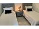 Bedroom with two twin beds, and a shared nightstand at 2505 Osprey Creek Ct, Kissimmee, FL 34747