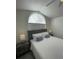 Bedroom featuring a bed, ceiling fan, and bedside tables with lamps at 2505 Osprey Creek Ct, Kissimmee, FL 34747