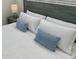 Bedroom featuring a bed, ceiling fan, and bedside tables with lamps at 2505 Osprey Creek Ct, Kissimmee, FL 34747