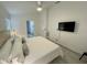 Bright bedroom featuring neutral tones, recessed lighting, and a flat screen television at 2505 Osprey Creek Ct, Kissimmee, FL 34747