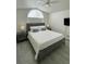 Bedroom featuring a bed, ceiling fan, and bedside tables with lamps at 2505 Osprey Creek Ct, Kissimmee, FL 34747