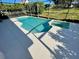 Stunning screened-in pool with white concrete patio and spillover spa at 2505 Osprey Creek Ct, Kissimmee, FL 34747