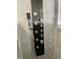 Close up view of a multi-setting wall-mounted shower panel featuring sleek fixtures at 2505 Osprey Creek Ct, Kissimmee, FL 34747